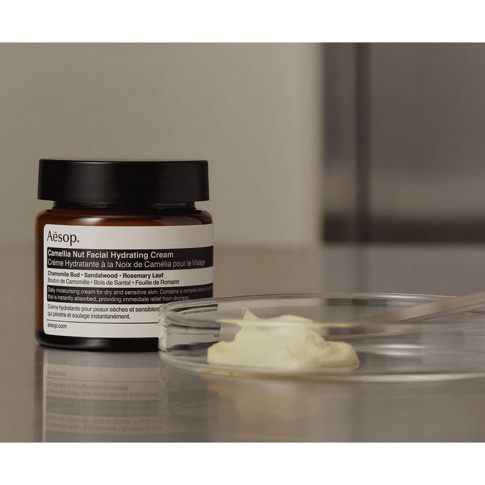 Aesop Camellia Nut Facial Hydrating Cream application on hand for easy daily use.