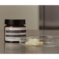 Aesop Camellia Nut Facial Hydrating Cream application on hand for easy daily use.