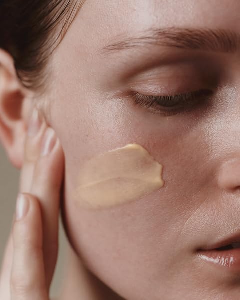 Aesop Camellia Nut Facial Hydrating Cream pump dispense for clean skincare routine.