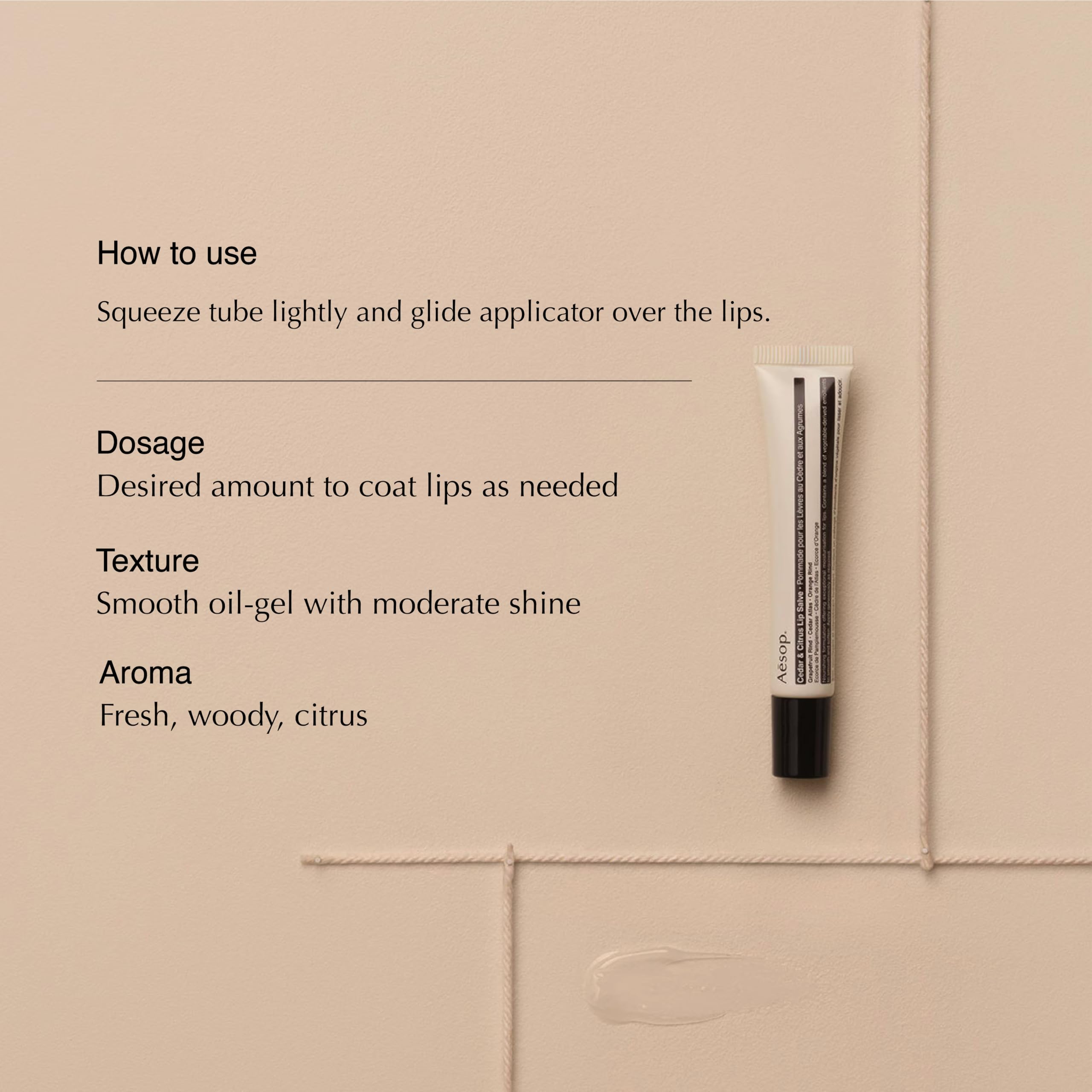 Aesop Cedar & Citrus Lip Balm application scene highlighting easy squeeze-tube precision.