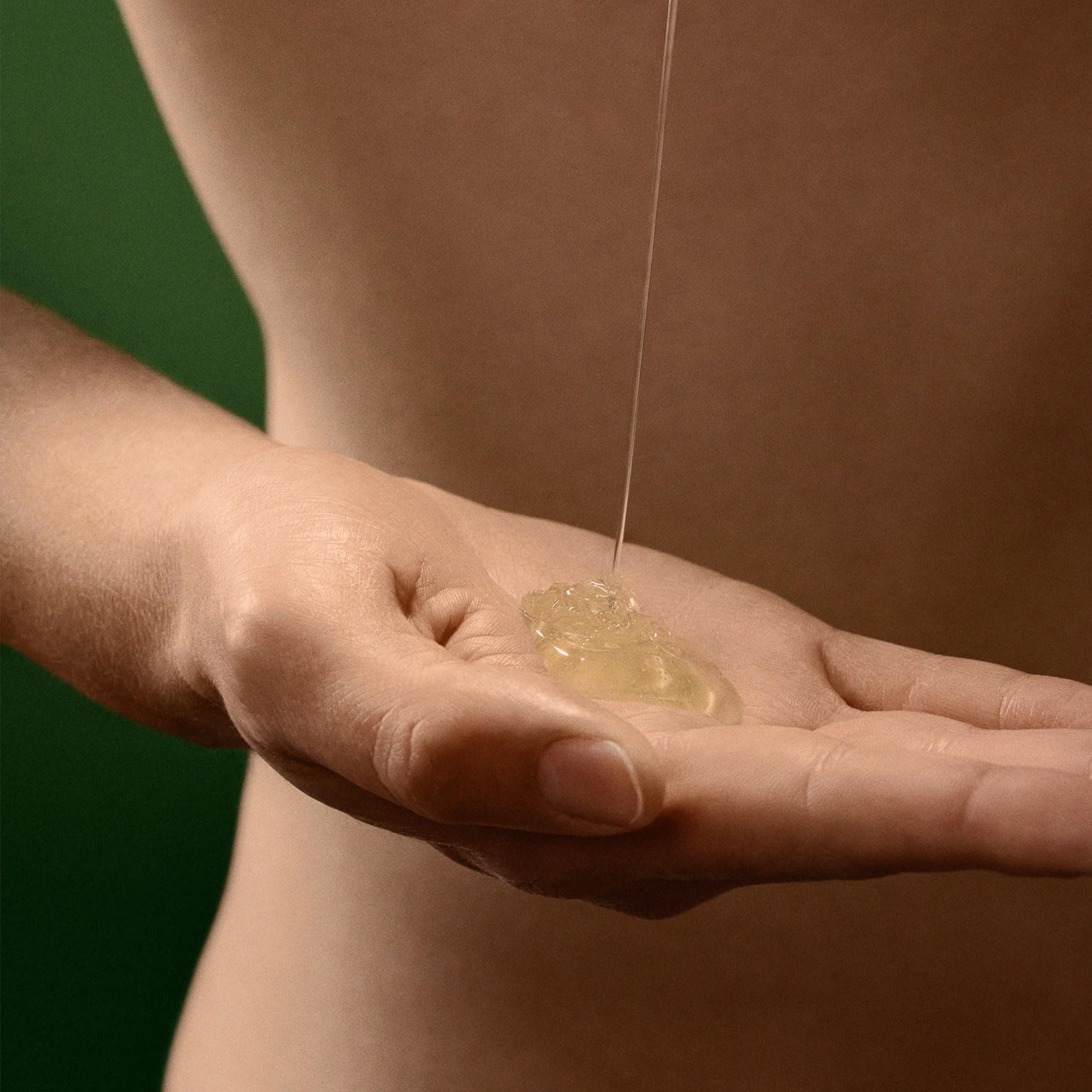 Aesop Geranium Leaf Body Cleanser foam closeup highlights creamy lather that cleanses gently.