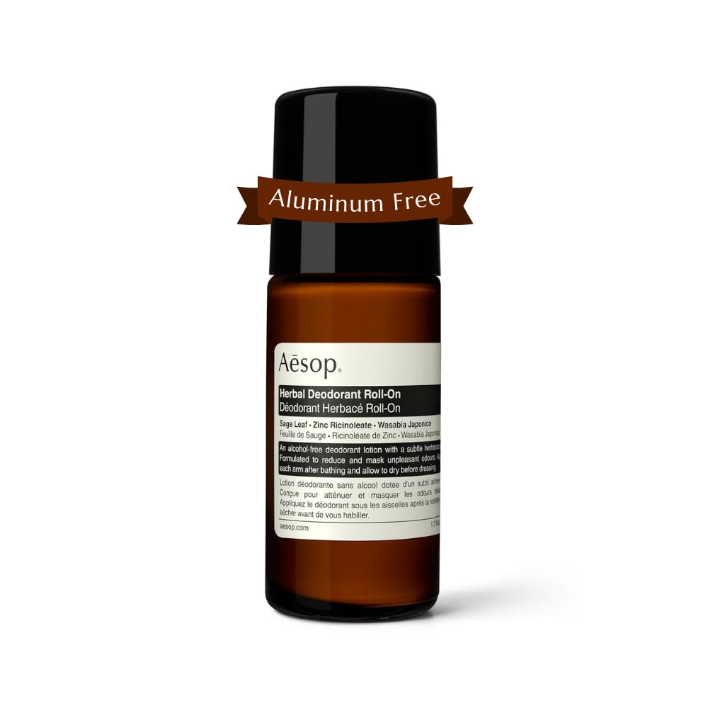 Aesop Herbal Deodorant Roll-On bottle close-up highlighting sage-leaf aroma.