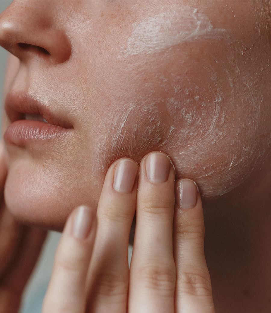 Aesop Purifying Facial Exfoliant Paste application demonstrating massage onto face and neck