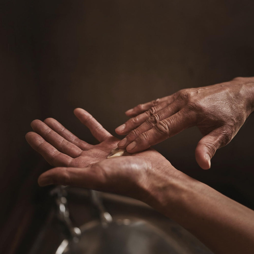 Aesop Rejuvenate Balm texture swirl, creamy and luxurious for dry skin.
