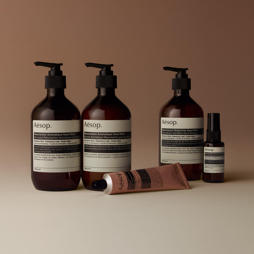 Aesop Resurrection Hand Balm applied to hands shows softening results
