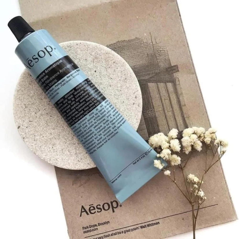 Aesop Reverence travel-size packaging with recycled aluminum tube.