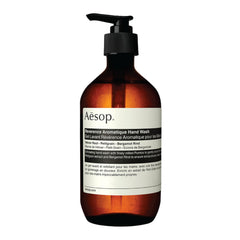 Aesop Reverence Aromatique Hand Wash bottle on a sink for refreshing daily cleanse.