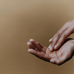 Aesop Reverence Aromatique Hand Wash with fine pumice exfoliant polishing the skin