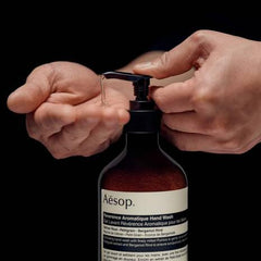 Aesop Reverence Hand Balm texture close-up hints at shea butter and macadamia softness.