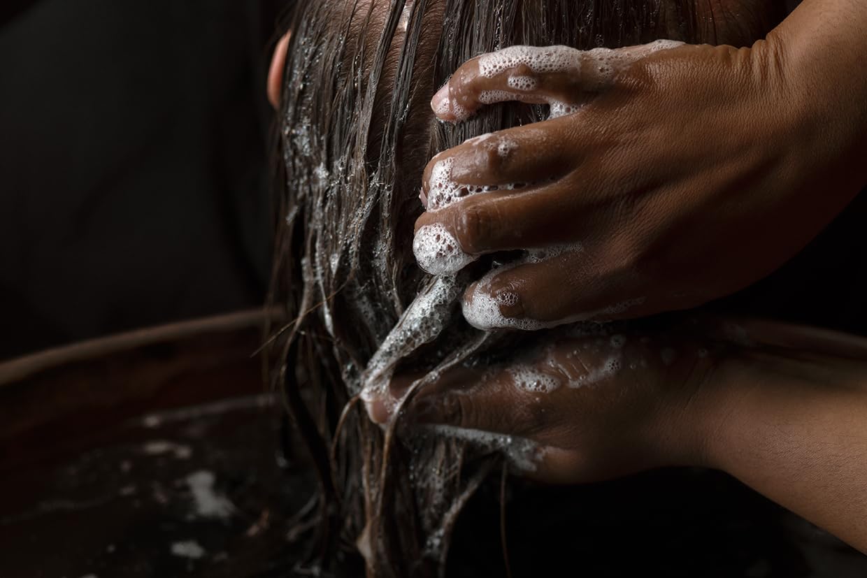 Aesop Shampoo lather on hair demonstrating gentle cleansing action