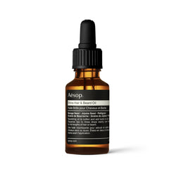 Aesop Shine Hair Oil bottle provides silicone-free hydration for smooth, lustrous hair.