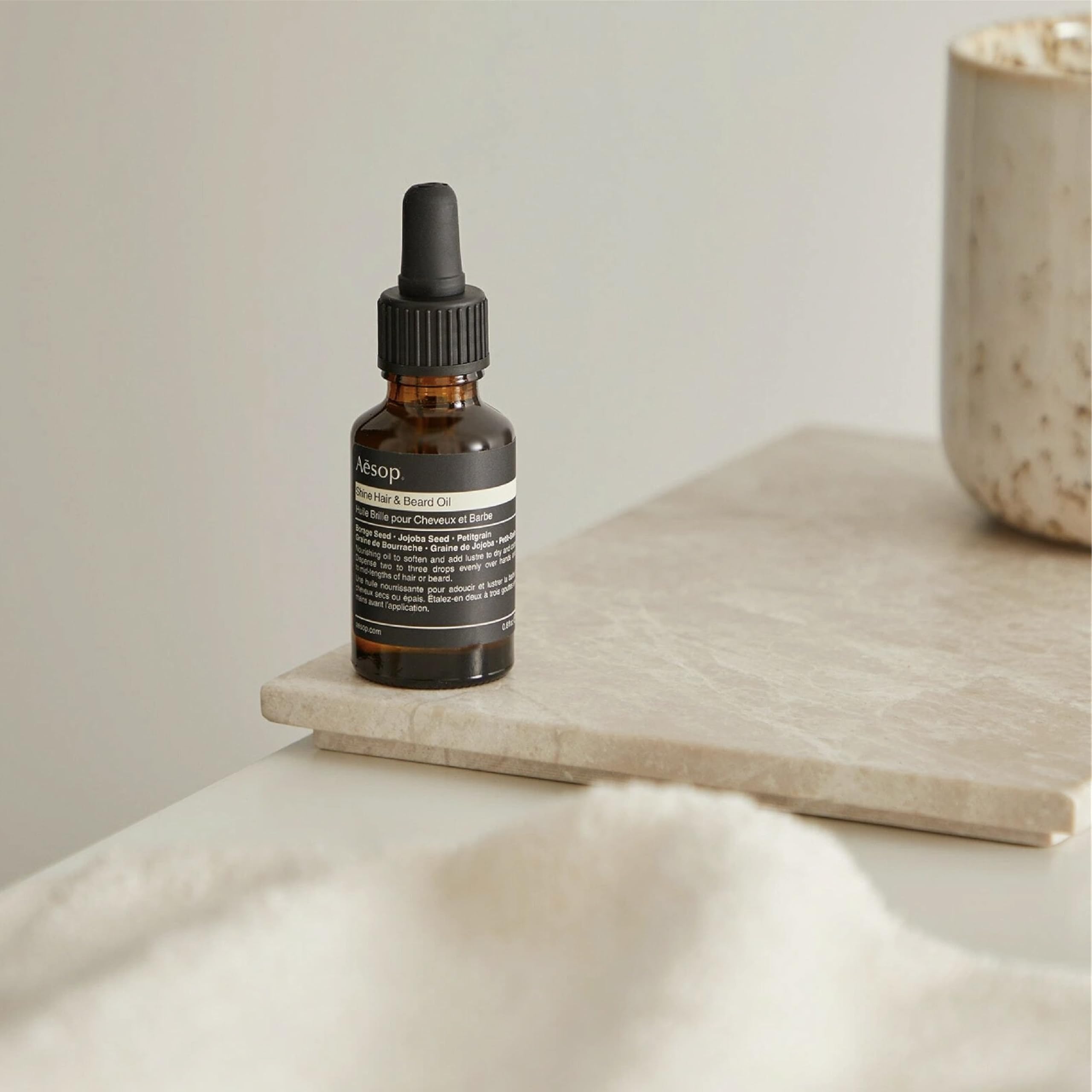 Aesop Shine Oil on ends reduces frizz and boosts shine.