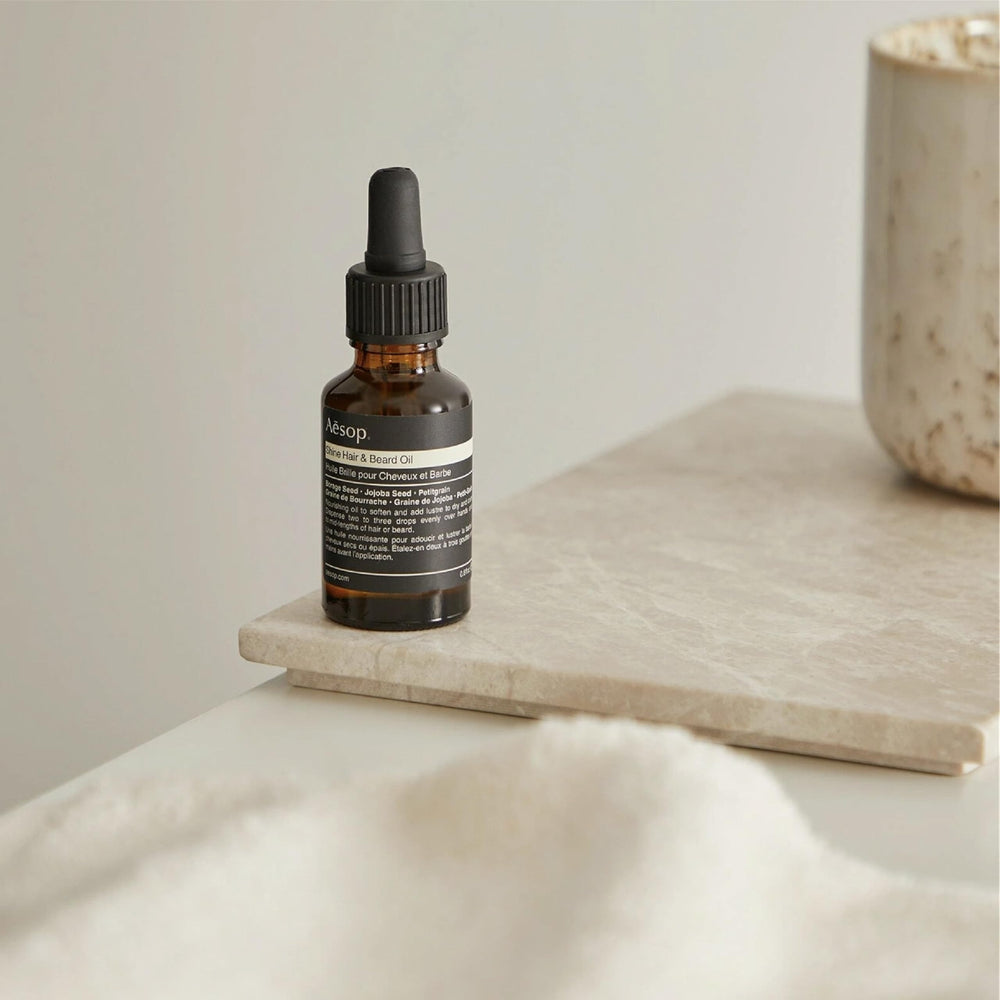 Aesop Shine Oil on ends reduces frizz and boosts shine.