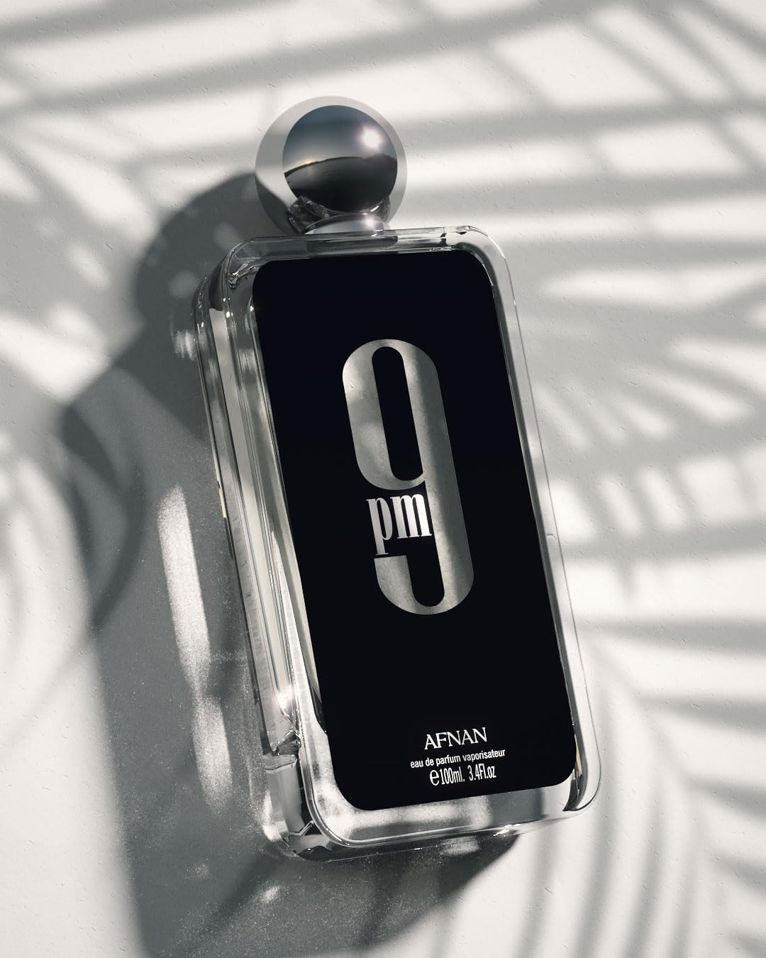 Afnan 9 PM base notes image showcases patchouli amber vanilla tonka for depth.