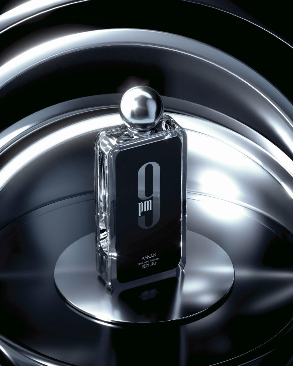 Afnan 9 PM top notes image emphasizes bergamot and apple for a fresh opening.