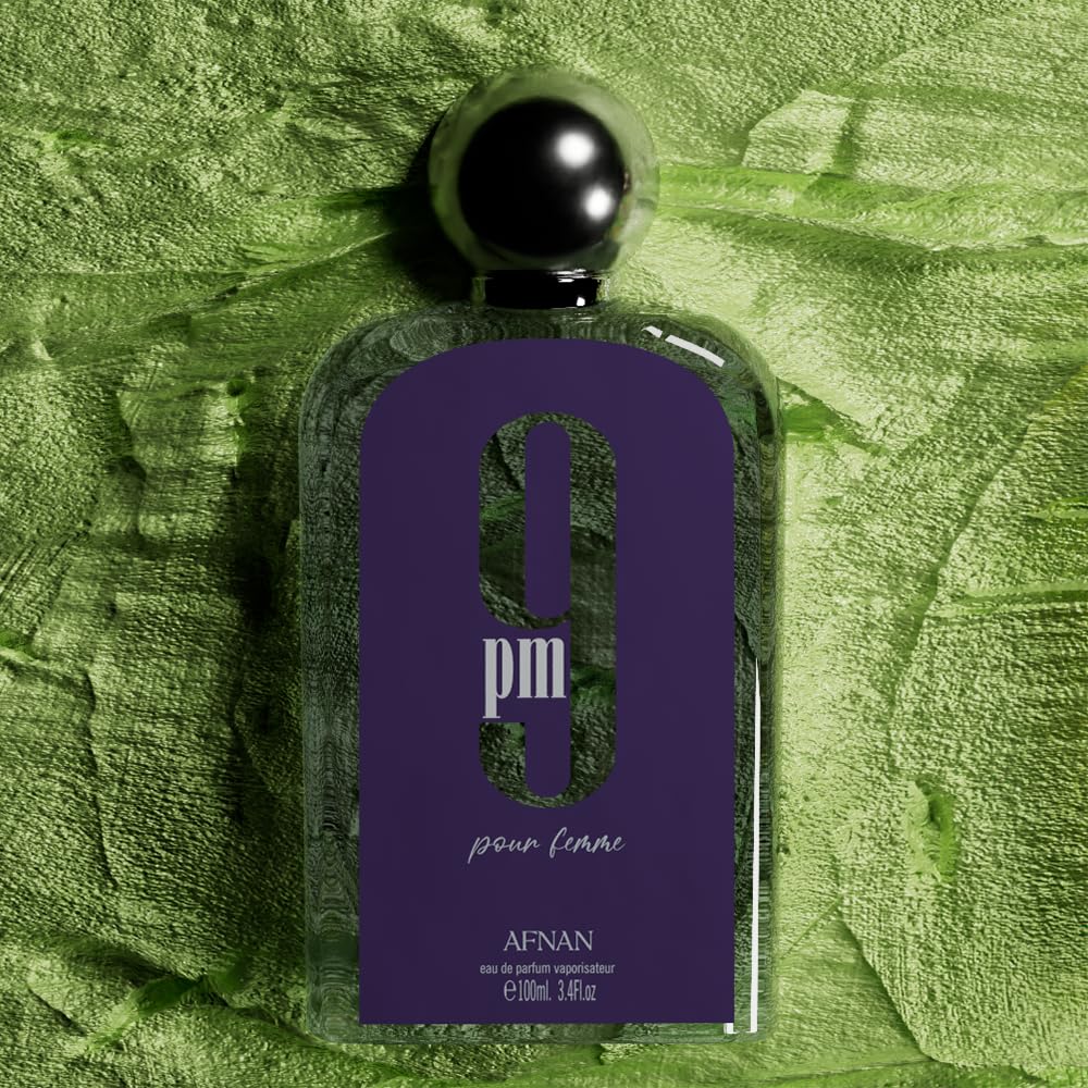 Afnan 9 PM Pour Femme amber-hue bottle glows with warmth.