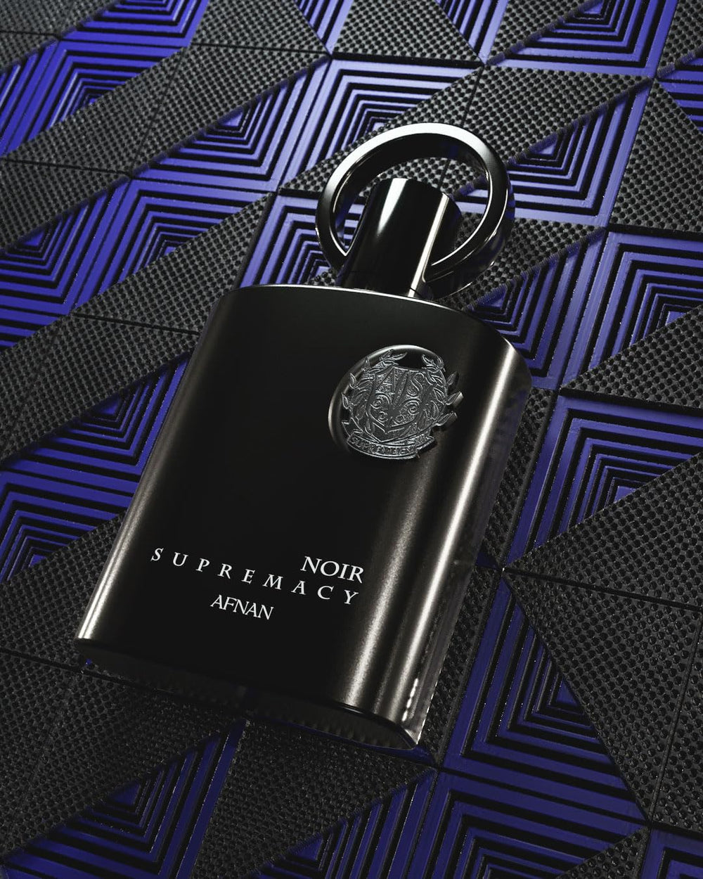Afnan Supremacy Noir display-statement capsule communicates premium fragrance craft.