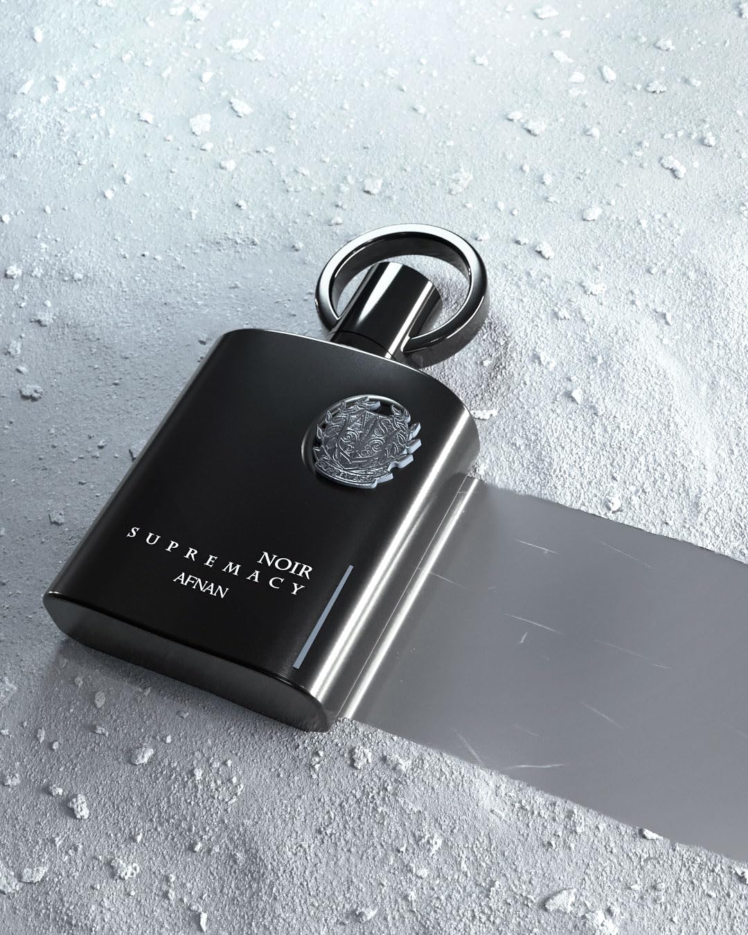 Afnan Supremacy Noir luxury bottle on a dress shirt suggests versatile day-to-night styling.