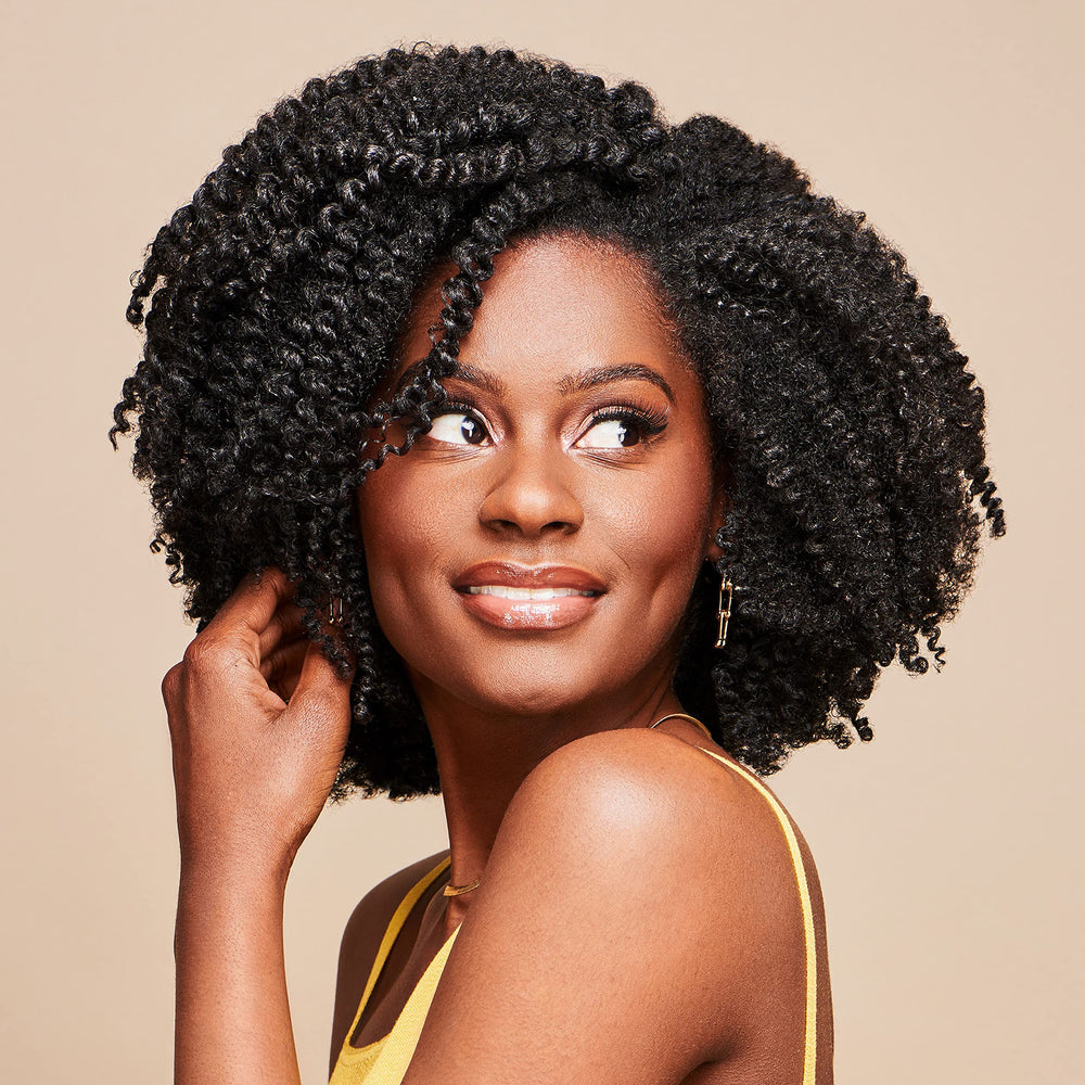 African Pride Moisture Miracle Curling Cream braid-outs deliver defined, moisturized coils
