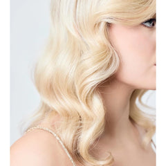AIIR Shine Spray flyaway-taming reduces stray hairs for a polished look.