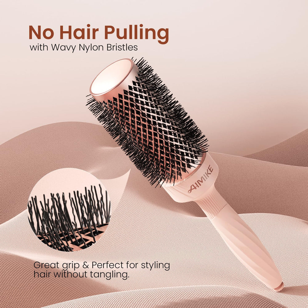 AIMIKE Rose Luxe Round Brush retractable pick for sectioning during blowouts.