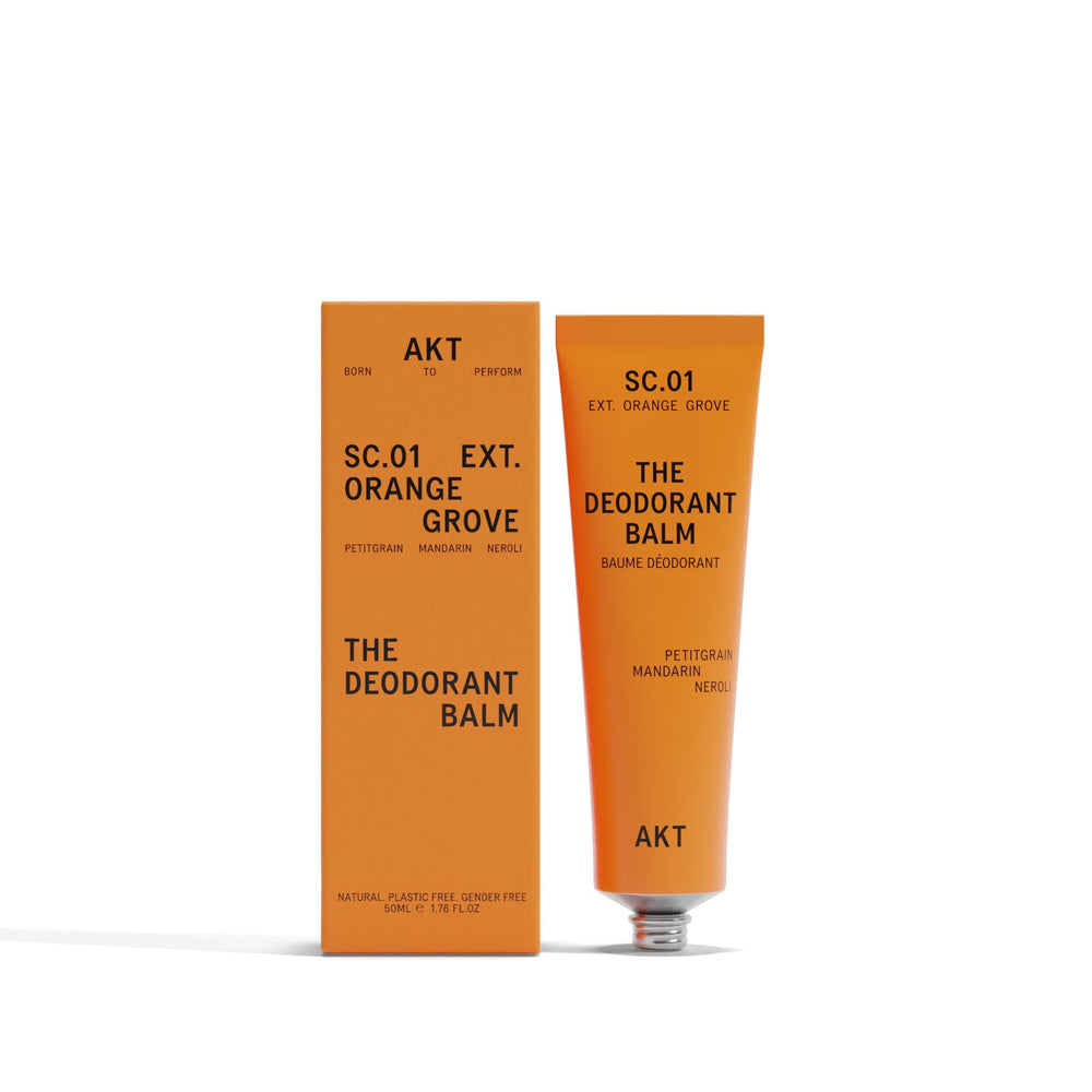 AKT Deodorant Balm Orange Grove tube for long-lasting odor protection on the go.