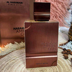 Al Haramain Amber Oud Tobacco Edition cap closeup highlighting premium packaging for gifting.
