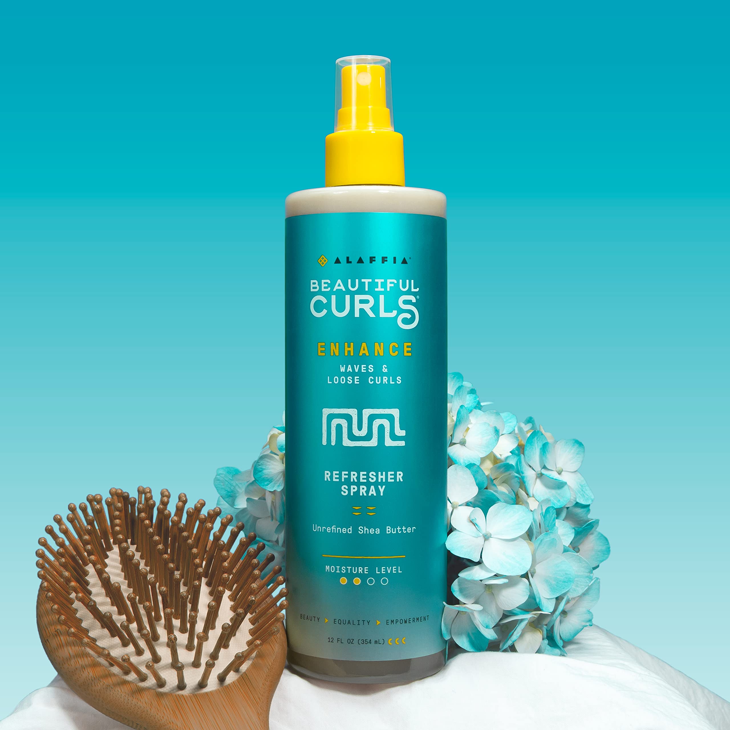 Hands applying Alaffia curl refresher before heat styling on damp hair.