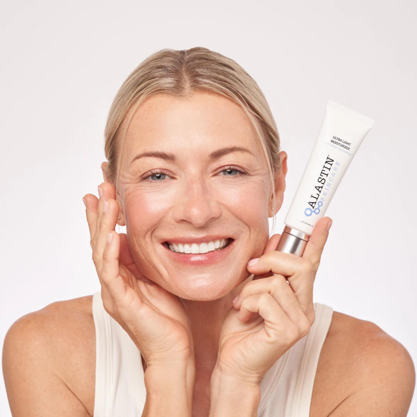 Close-up of ALASTIN Ultra Light Daily Face Moisturizer bottle cap, emphasizing non-greasy hydration