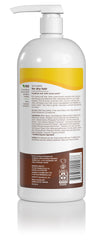 Alba Botanica More Moisture Coconut Milk Shampoo pour showing creamy lather for moisture.