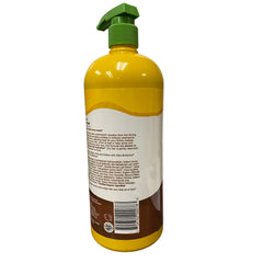 Alba Botanica More Moisture Shampoo bottle with rich lather demonstrating gentle cleansing for dry hair