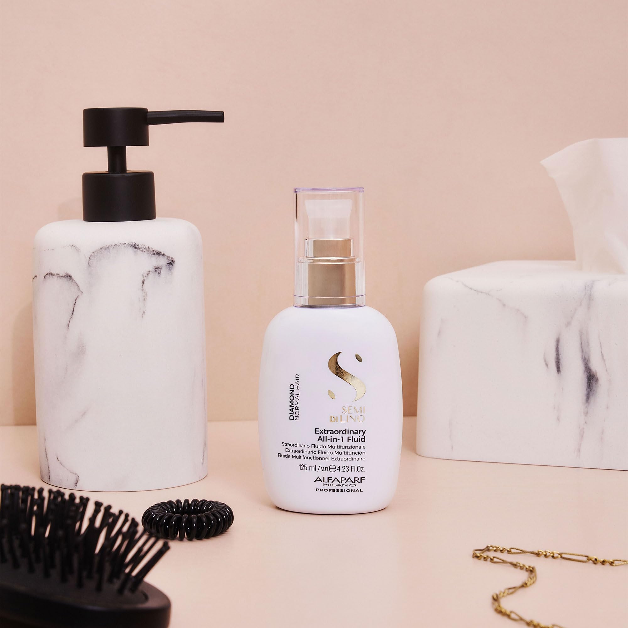 ALFAPARF MILANO Diamond leave-in being brushed through hair for smoothness