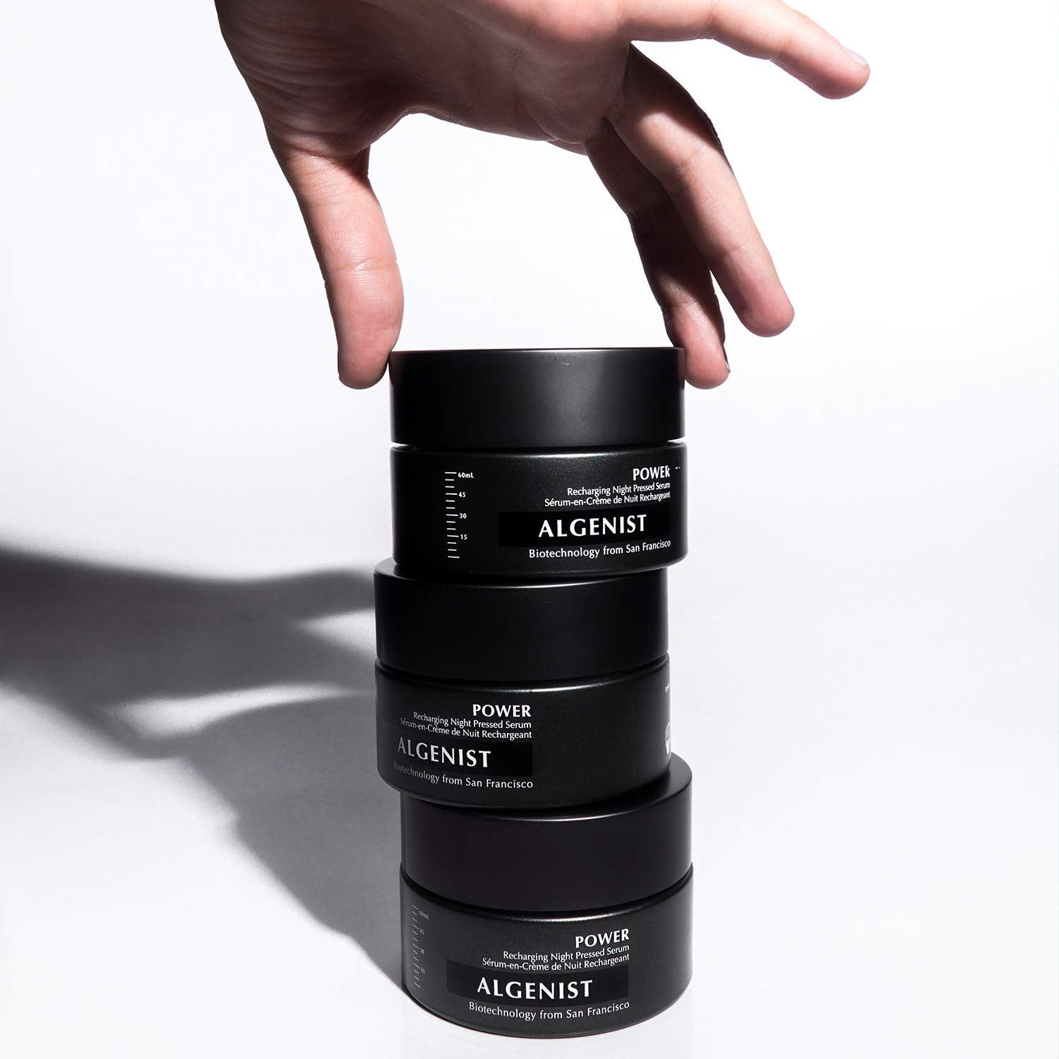 Algenist Power Recharging Night Pressed Serum solid form transitioning on skin