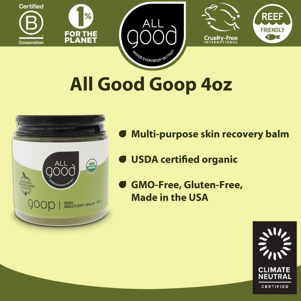 All Good Goop calendula-infused balm beside calendula flowers for soothing skin.