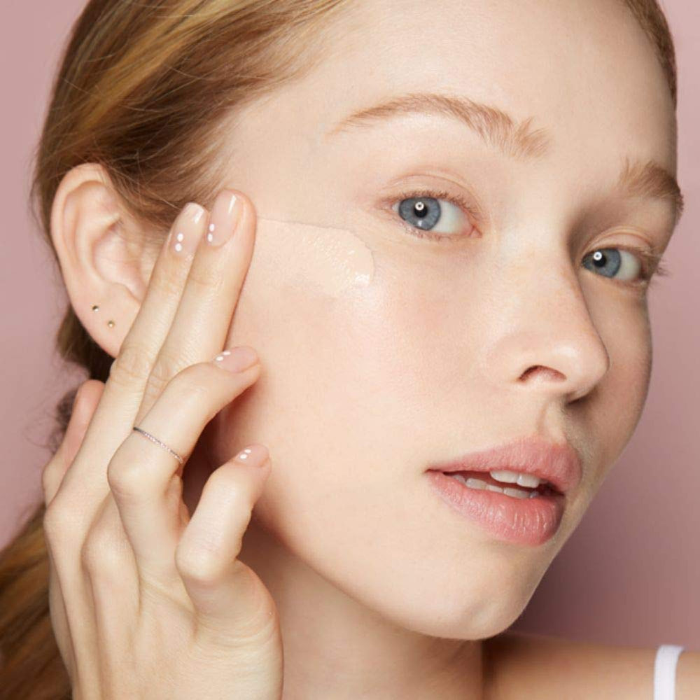 Almay liquid foundation Vitamin E lemon extract label highlighting nourishing ingredients.
