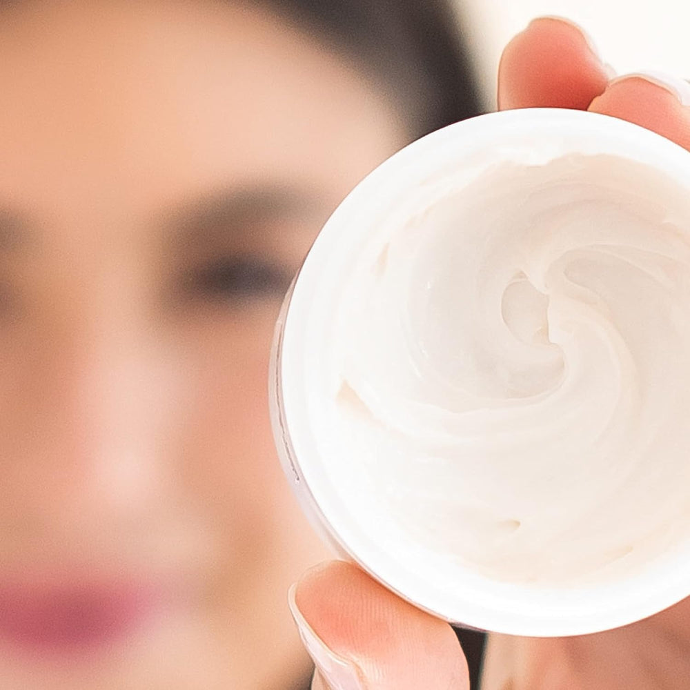 Alpha Skin Care Essential Renewal Cream texture close-up shows rich, hydrating cream.