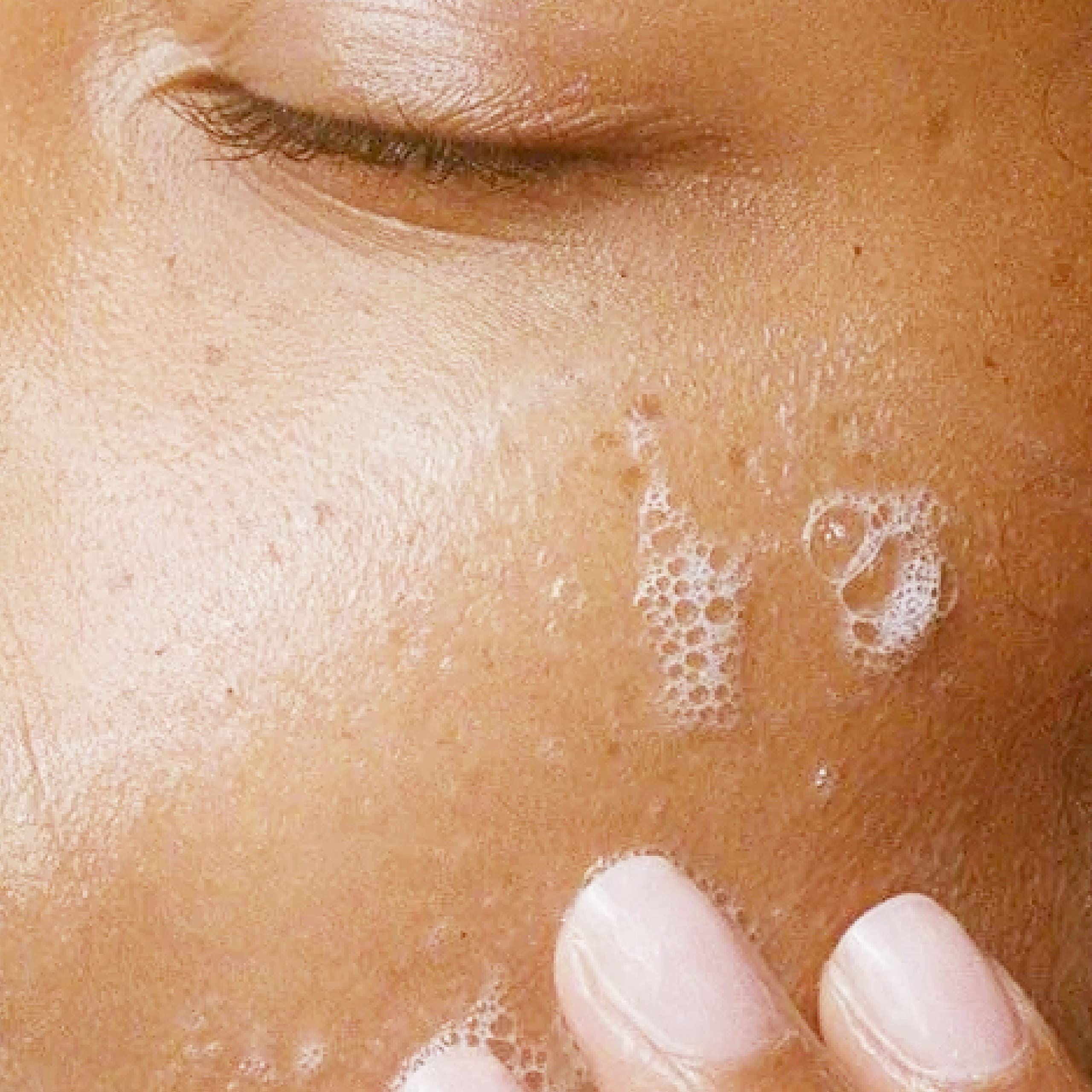 Alpha Skin Care Refreshing Face Wash massage-application shows gentle cleansing for neck and face.