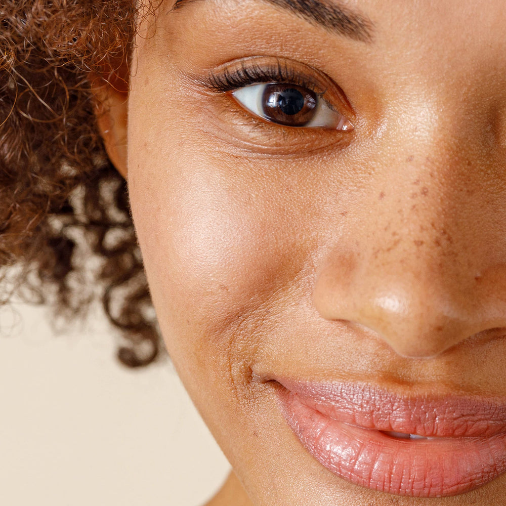 Alpha Skin Care Renewal Serum applied to skin during routine for exfoliation.