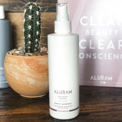 ALURAM leave-in spray bottle in use illustrating easy detangling