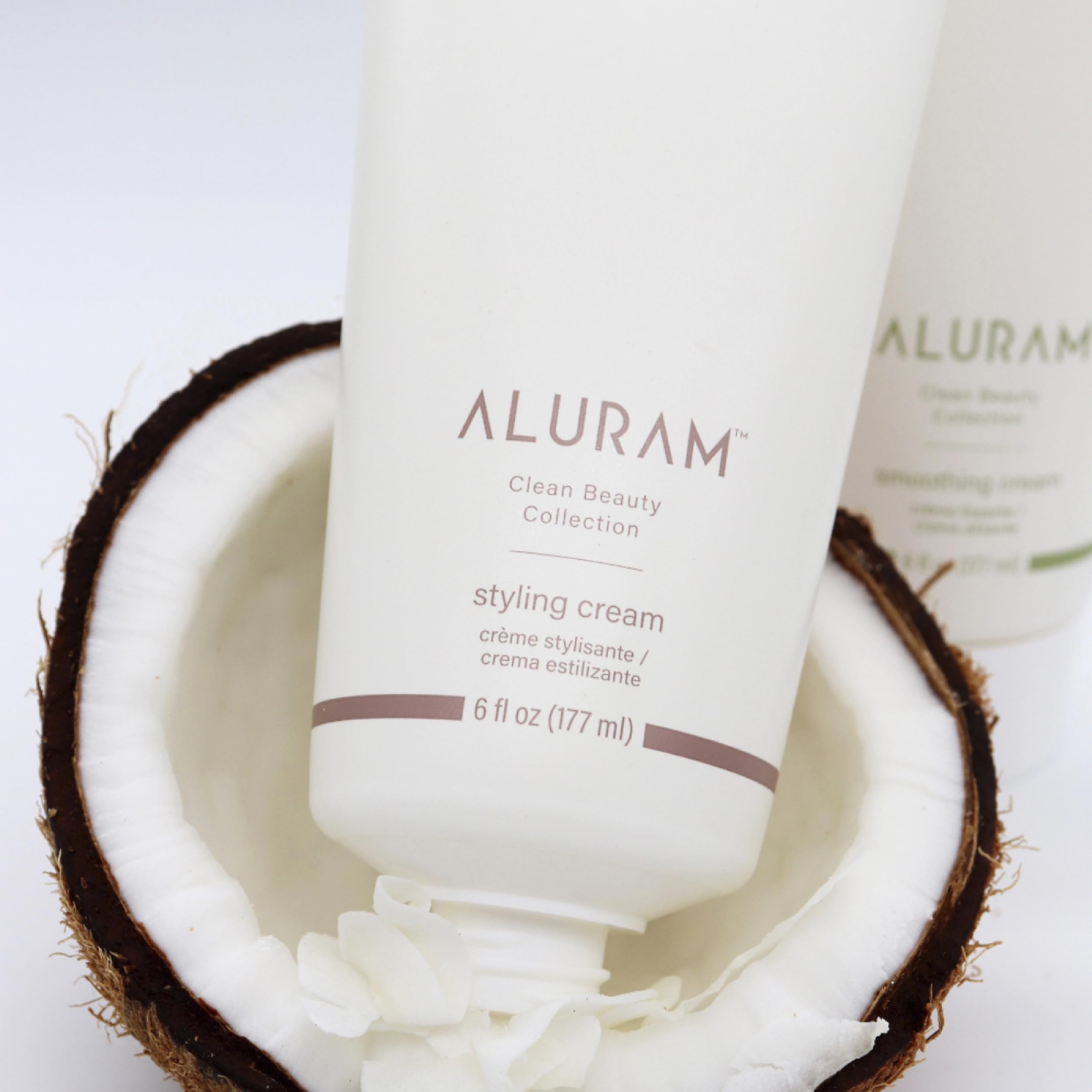 ALURAM styling cream application on hands for quick distribution across hair types