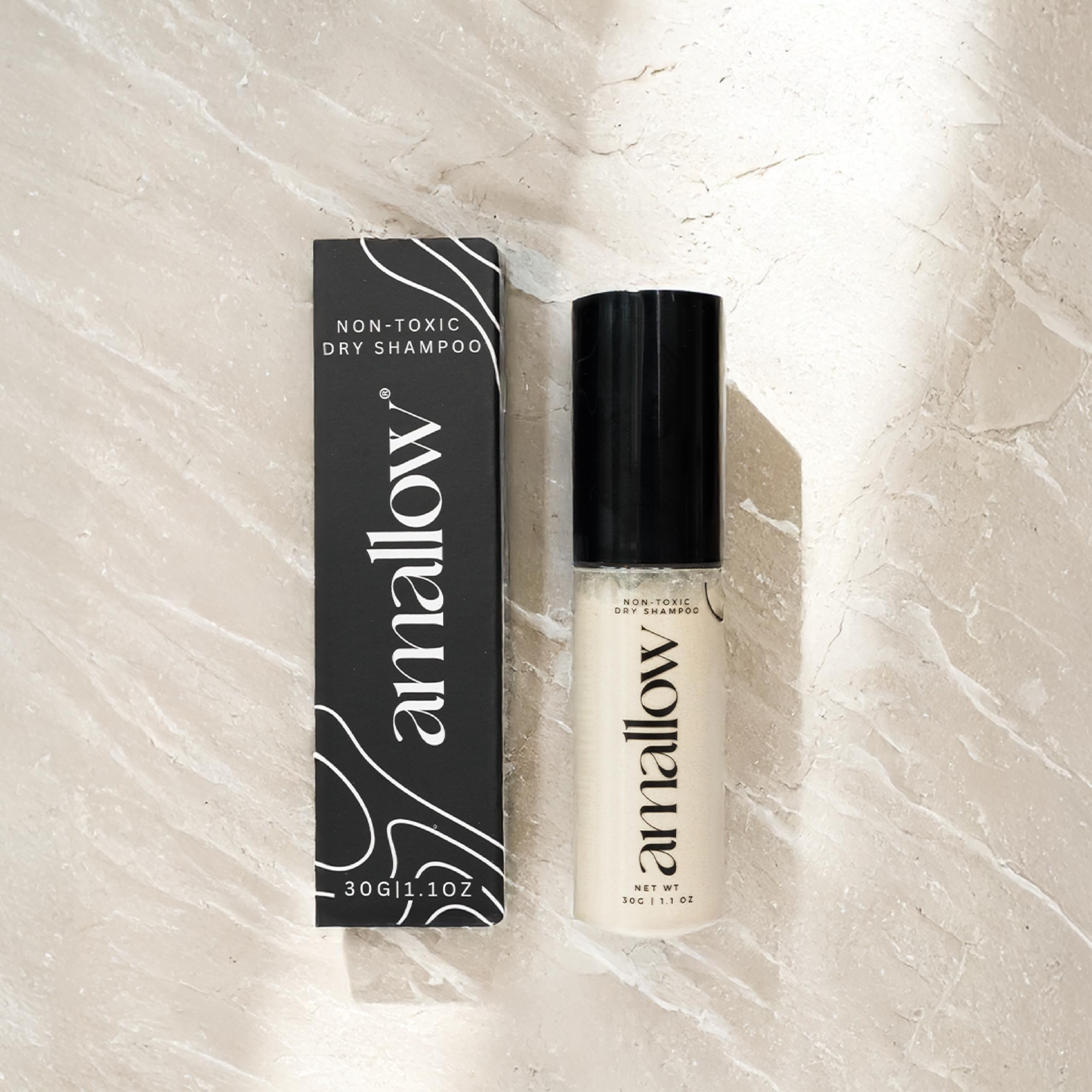 Amallow dry shampoo powder texture reveals arrowroot and bentonite blend for oil control.