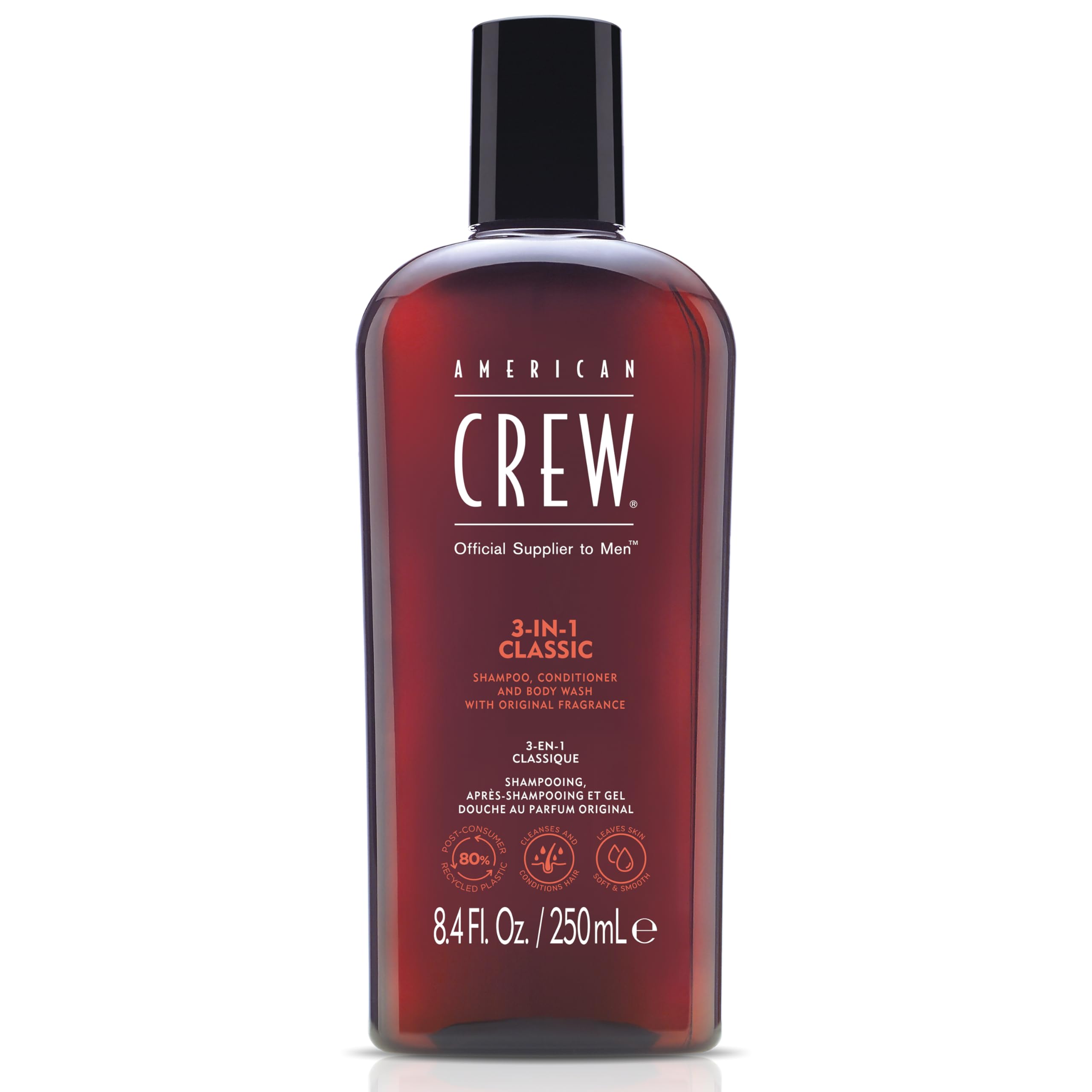 American Crew 3-in-1 bottle pouring, showcasing convenient all-in-one cleansing for hair and skin.