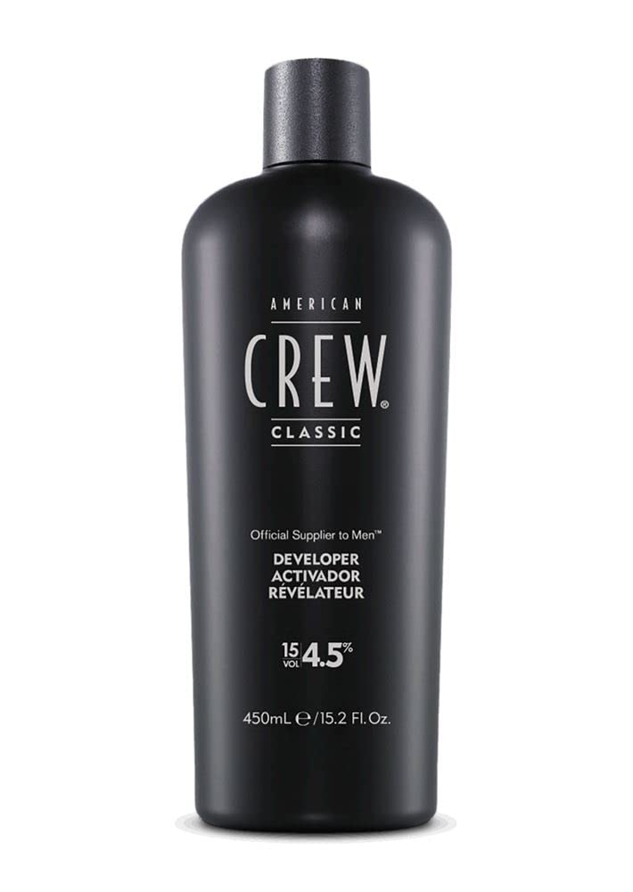 American Crew developer 15-volume pour demonstrates controlled mixing for precise color results.