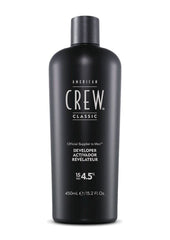 American Crew developer 15-volume pour demonstrates controlled mixing for precise color results.