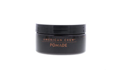 American Crew pomade styled into a classic slick-back with high shine.