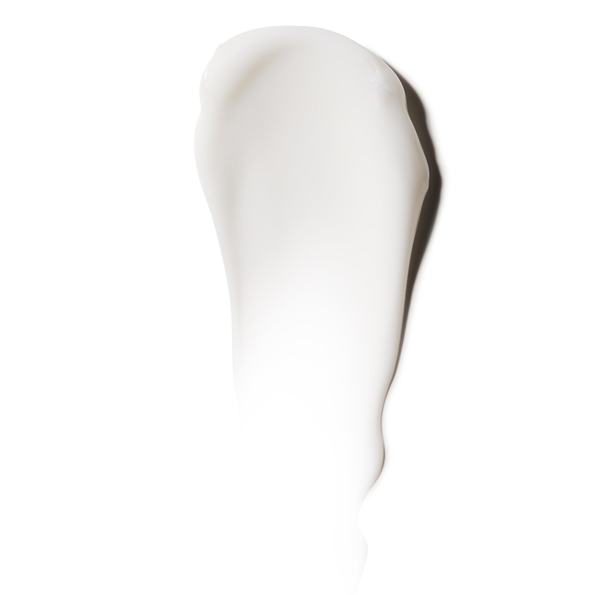 American Crew Shave Cream texture close-up highlighting non-drying, soothing feel.
