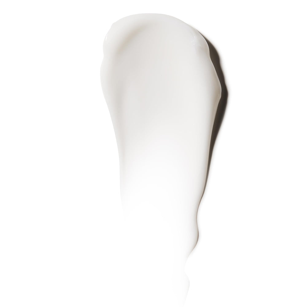 American Crew Shave Cream texture close-up highlighting non-drying, soothing feel.