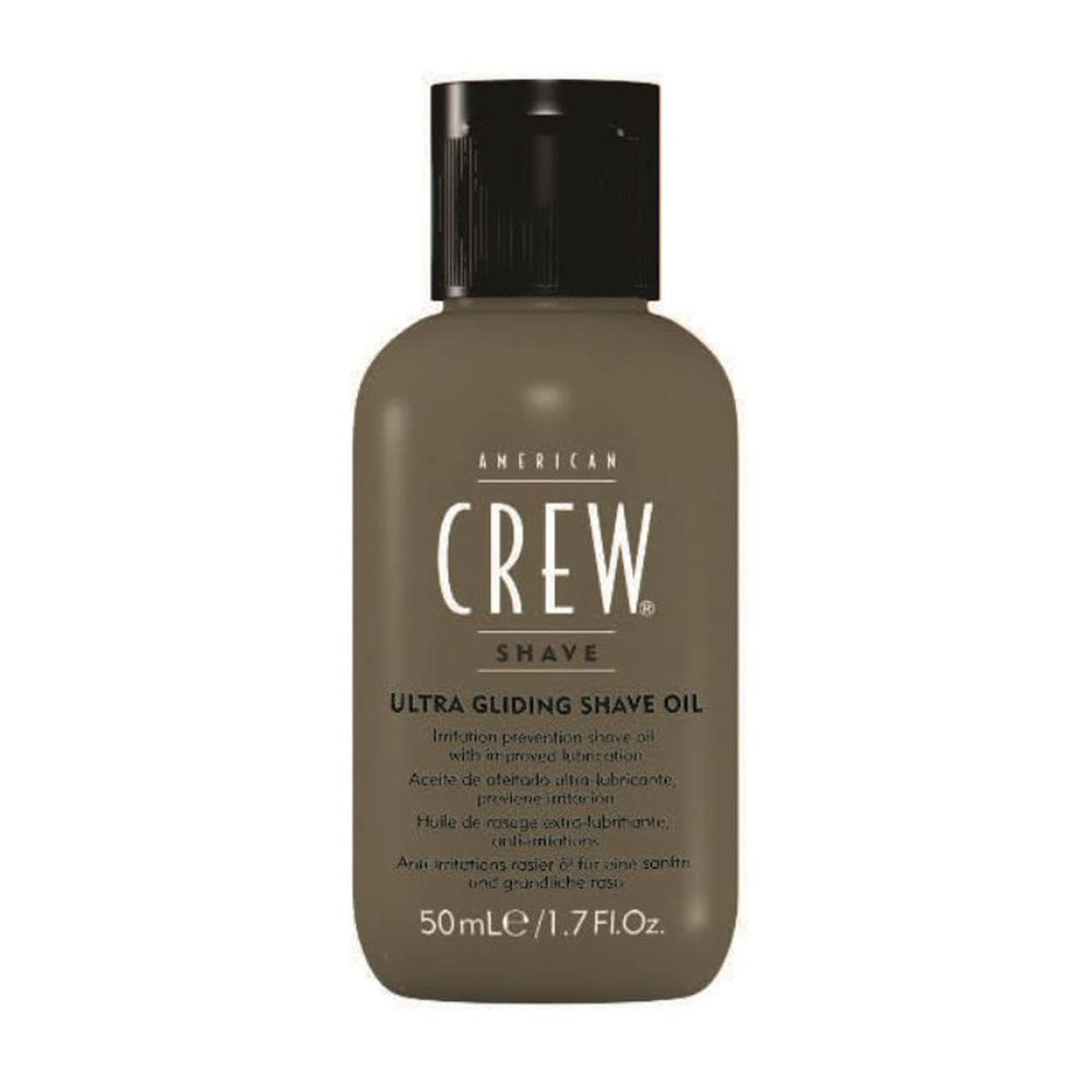 American Crew shave oil being poured for easy application.