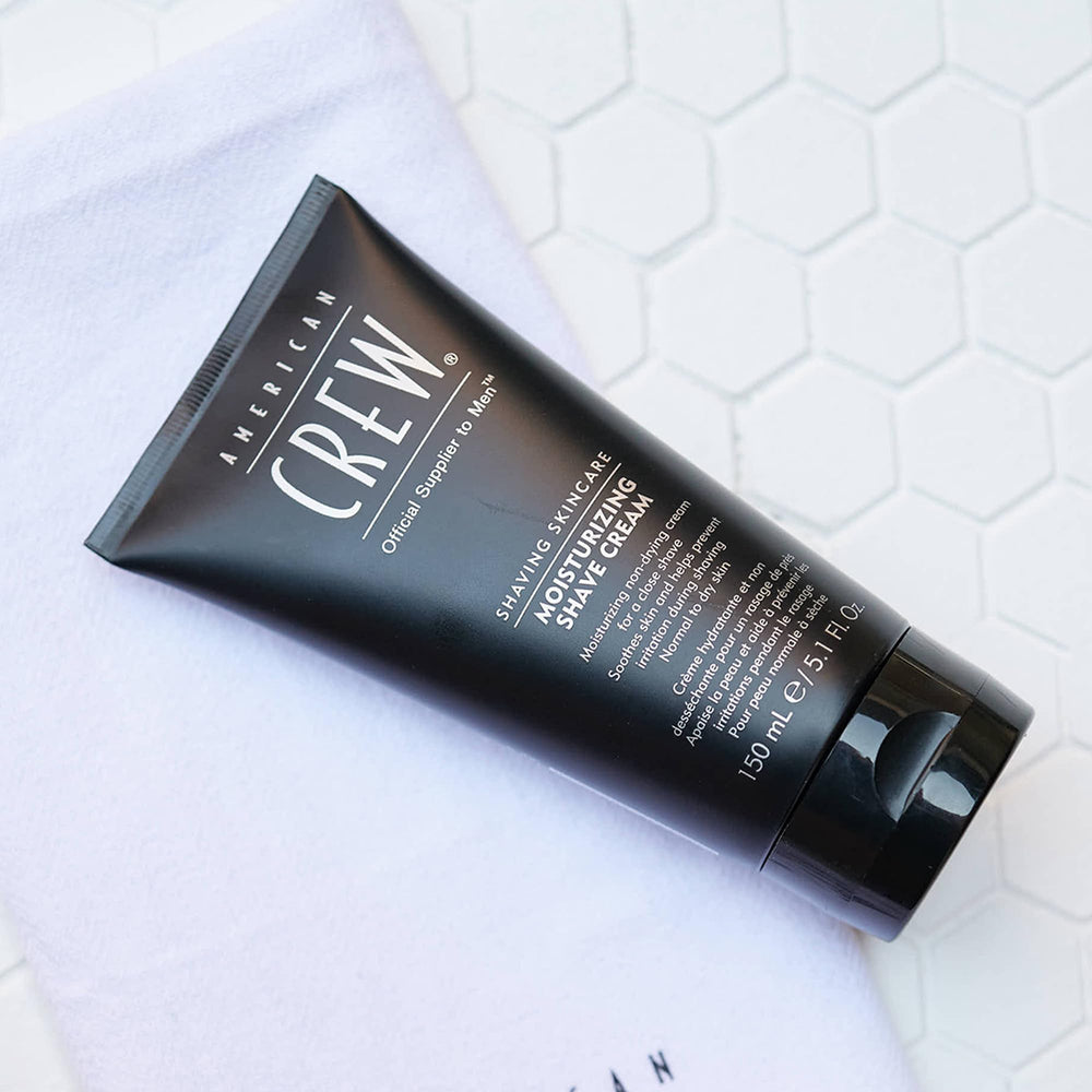 American Crew product during warm water rinse suggesting soothing shaving possibility.