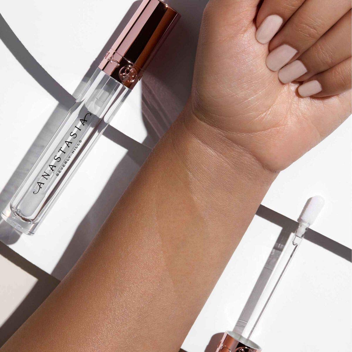 Anastasia Beverly Hills Crystal Gloss shade swatch on skin showing radiant gloss.